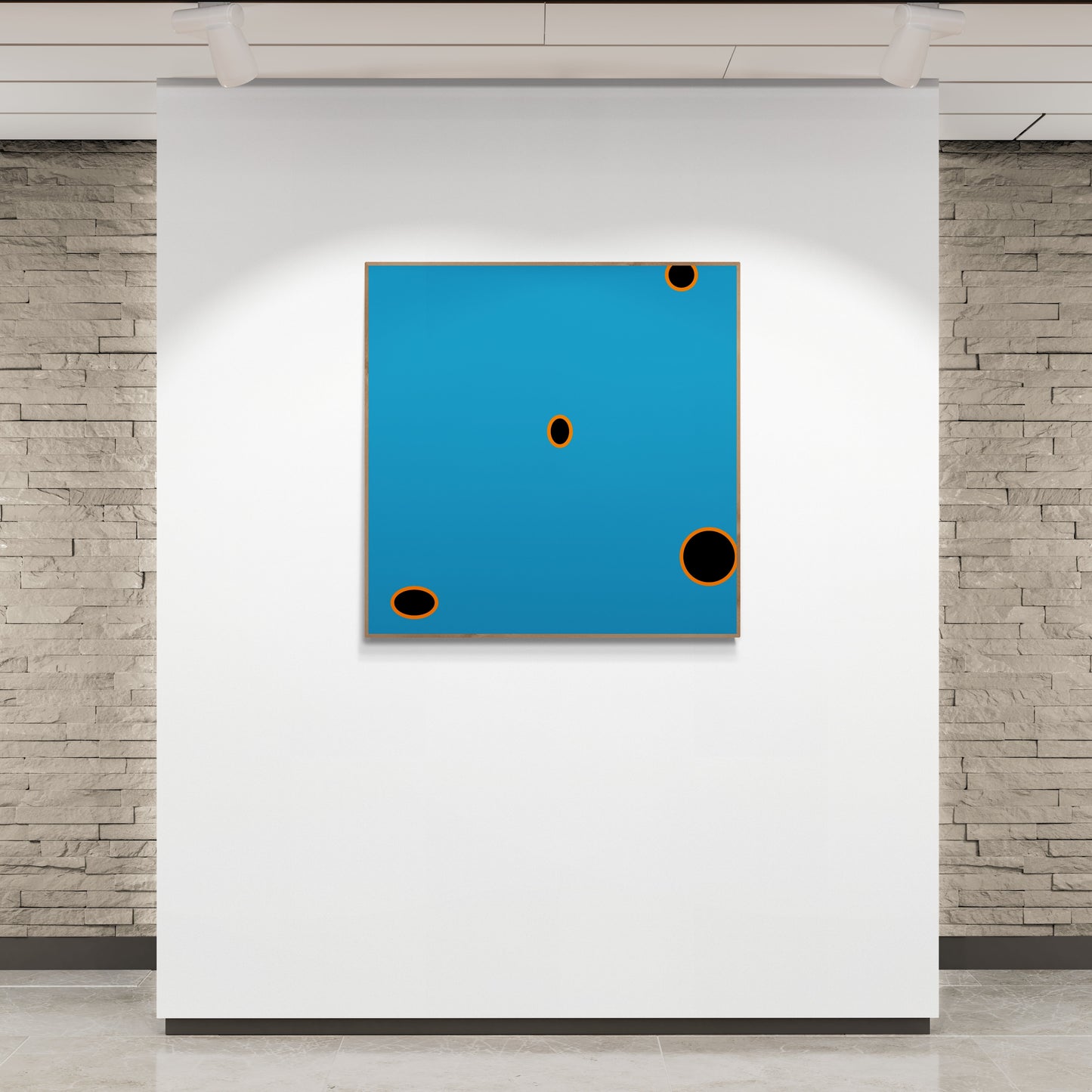 Abstract art print with blue background and black circles on a white wall.