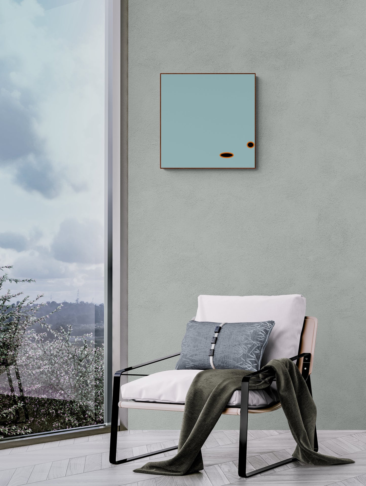 Modern interior with a chair, cushions, and a framed light blue artwork print on a gray wall.