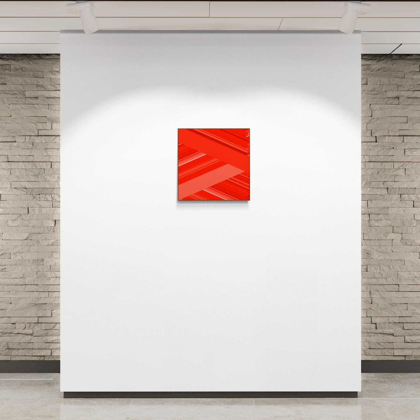 Art print of abstract red design with geometric shapes on a red background on a white wall with stone walls in the background
