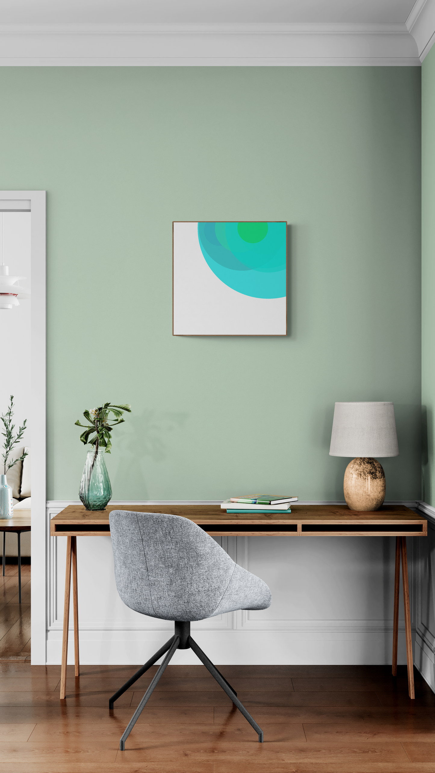 Modern home office with a desk, chair, and wall art print in a room with green walls.
