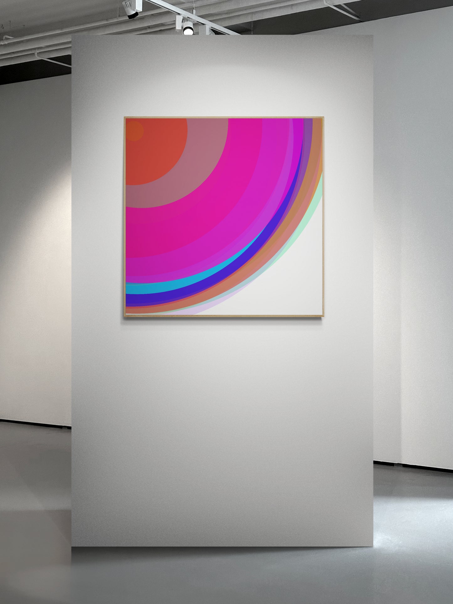 Art print of colorful circular spheres with a gradient effect on a white wall in an art gallery.
