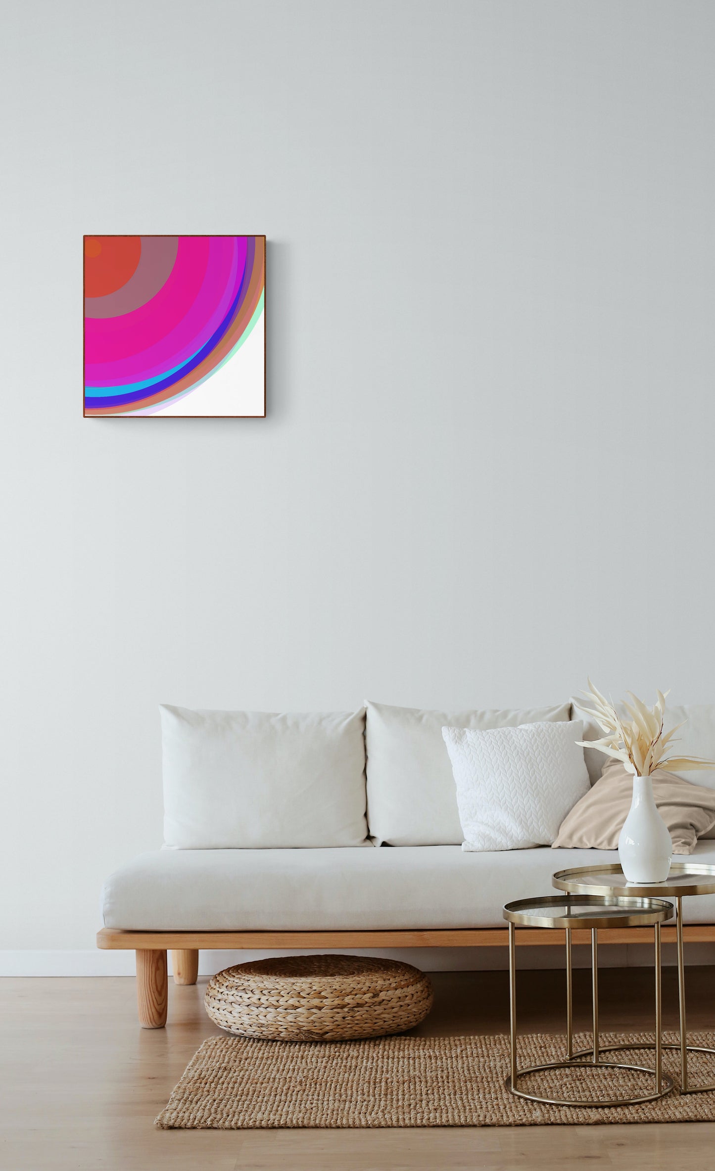 Modern living room with an art print of colorful circular spheres with a gradient effect on the wall above a white sofa.