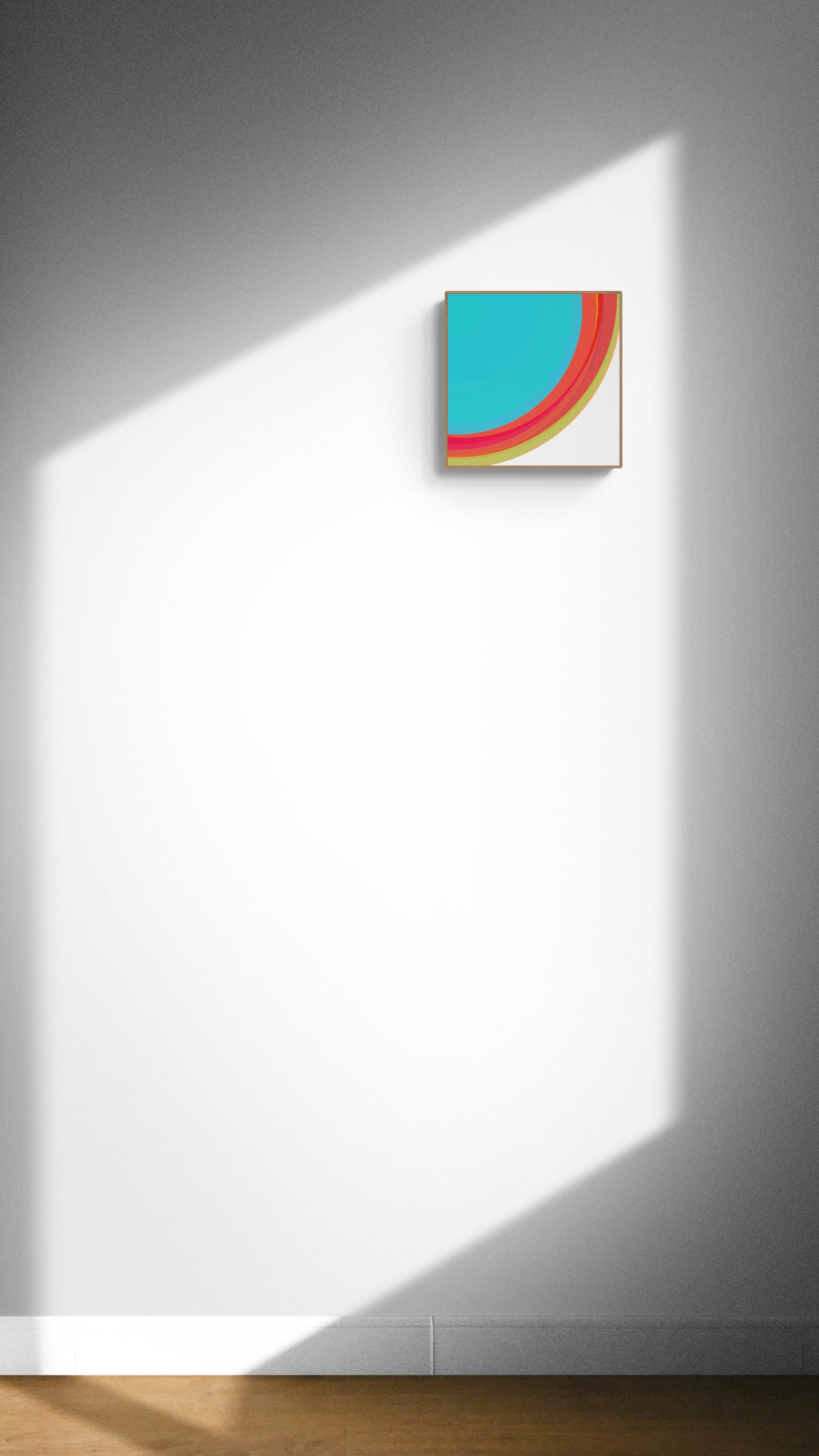 Abstract art print with colorful geometric shapes on a white wall