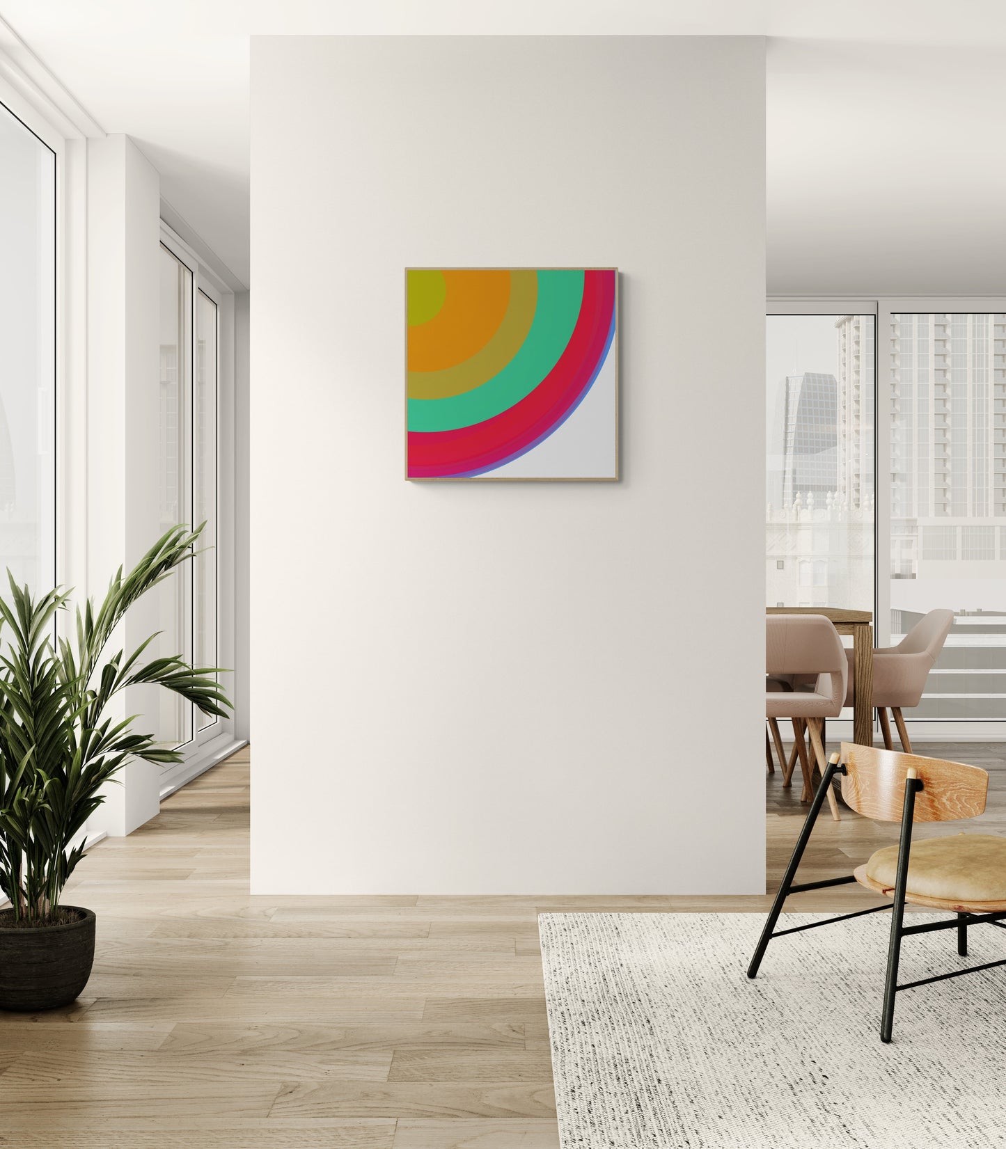 Colorful abstract art print on a white wall in a modern interior setting with a plant and chair.