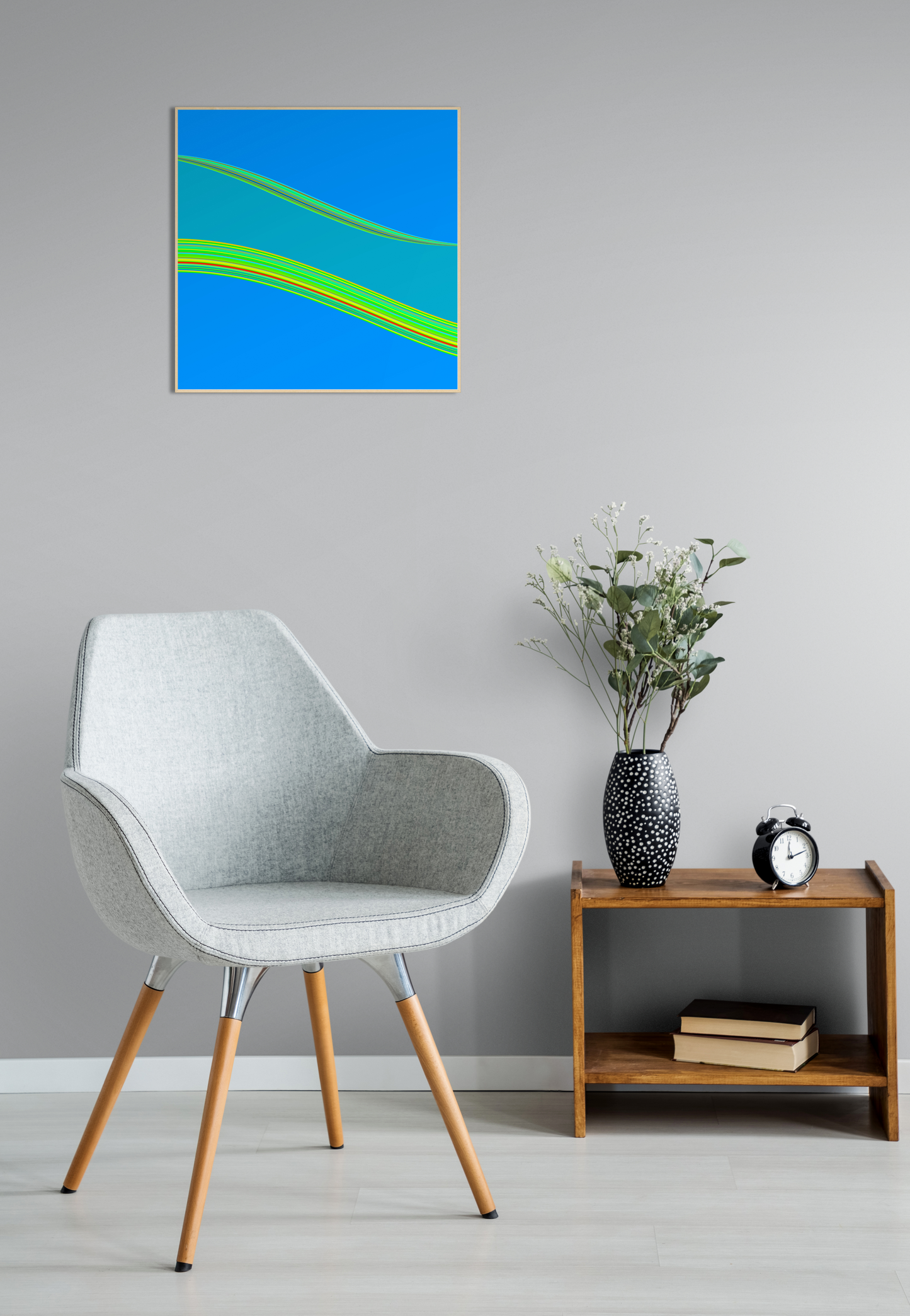 Modern interior with a chair, side table, and abstract generative art print on the wall.