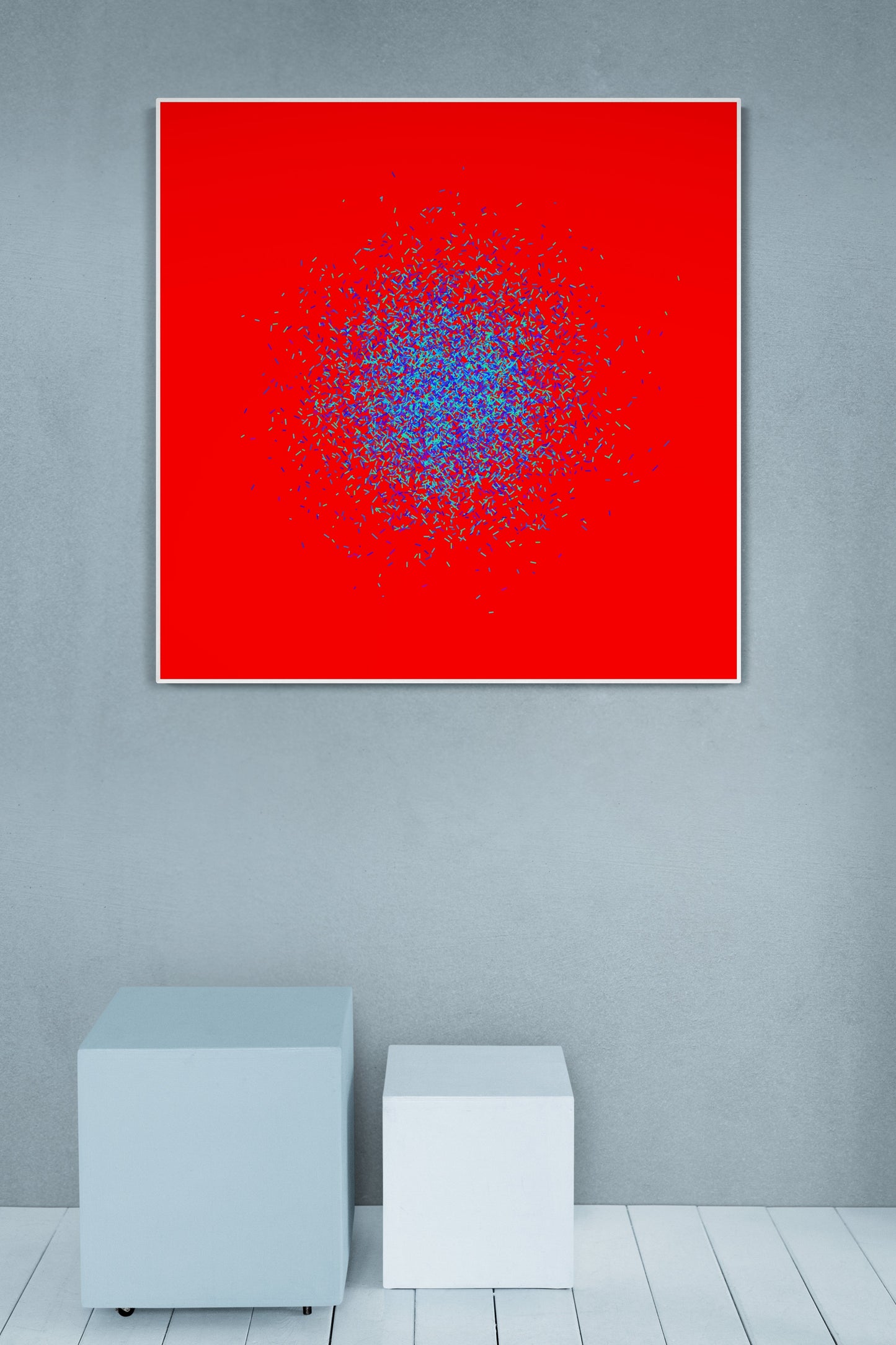Blue, green, purple confetti like patterned abstract print on a red background in a minimalistic room.