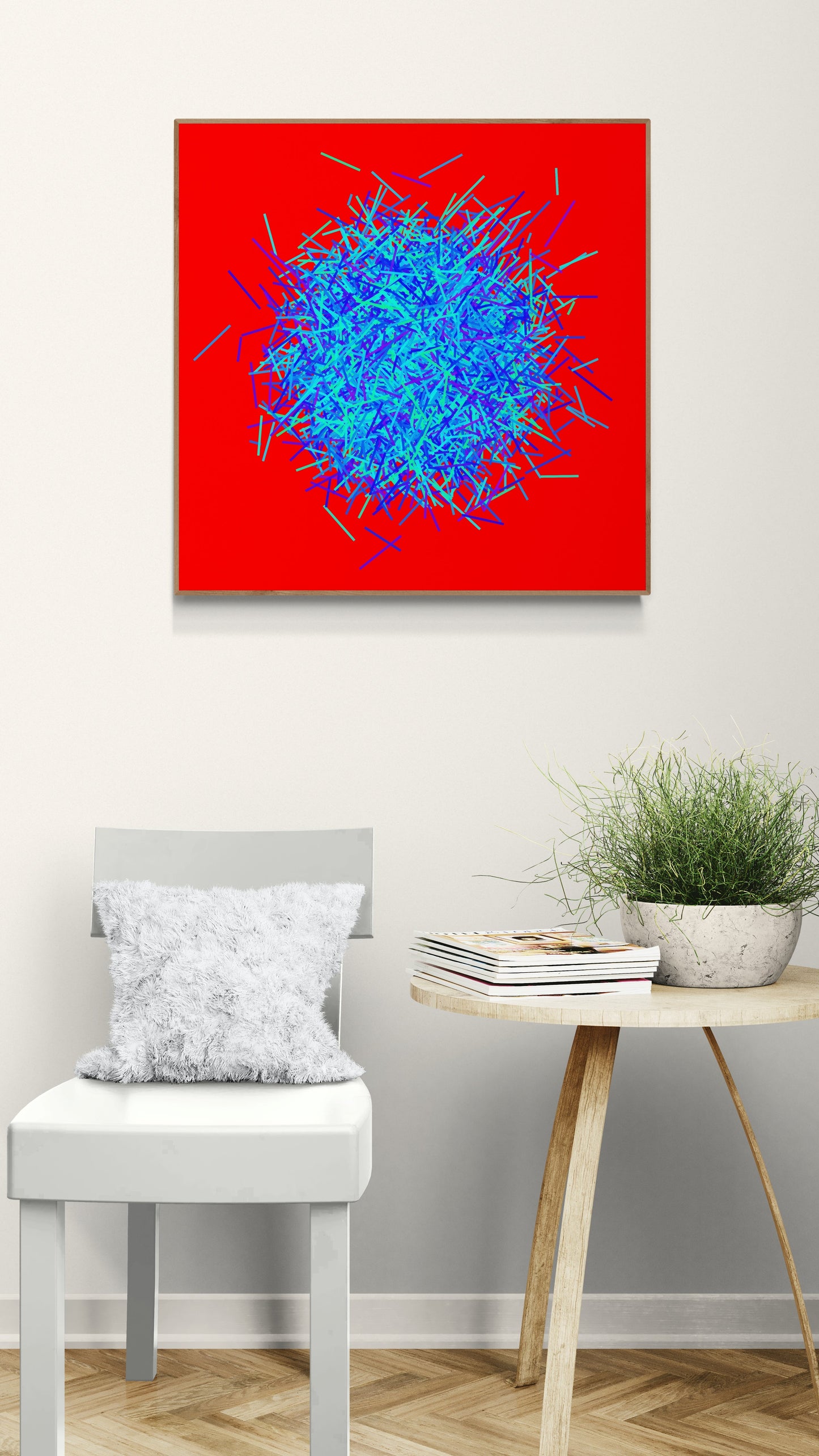 Abstract patterned art print of ball of blue and green lines on a red background in a room with a chair and table.