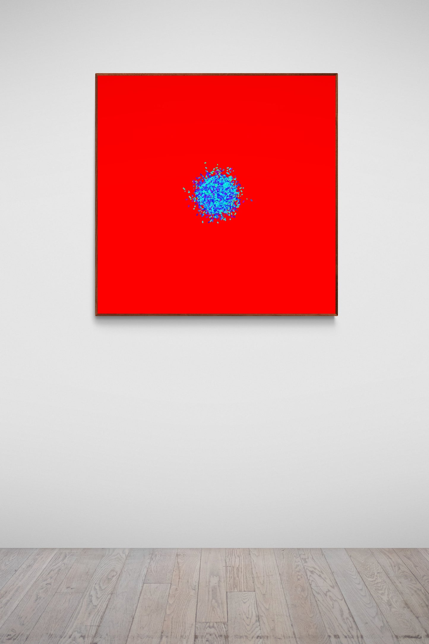 Abstract patterned art print of ball of blue and green fragments on a red background in an art gallery.