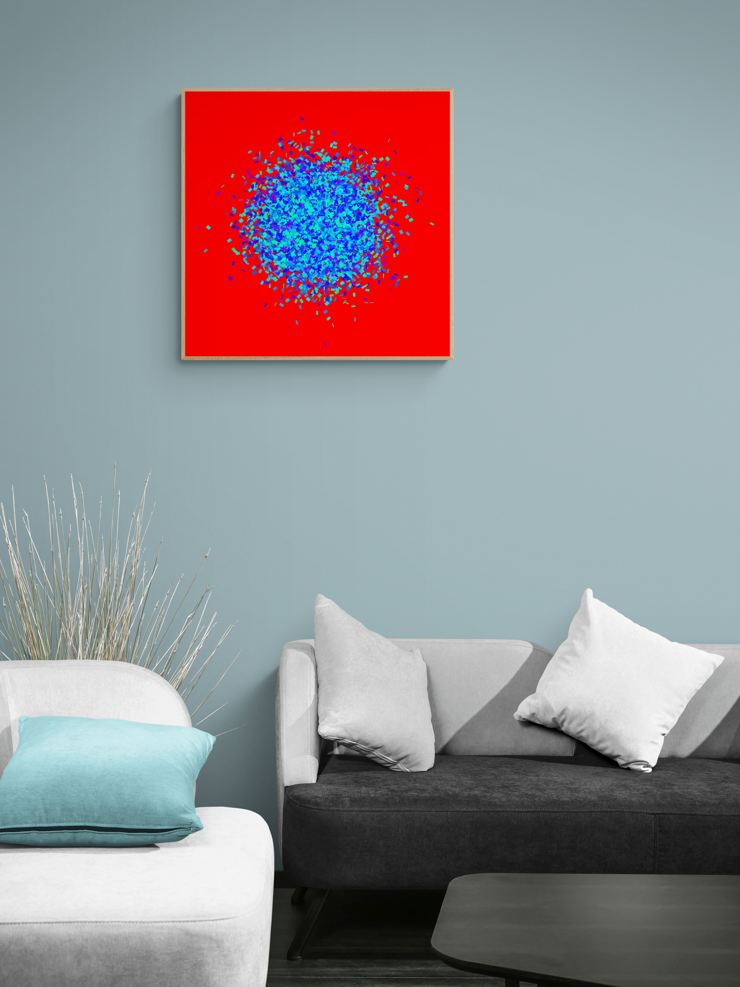Blue, green, purple confetti like patterned abstract print on a red background in a living room setting.
