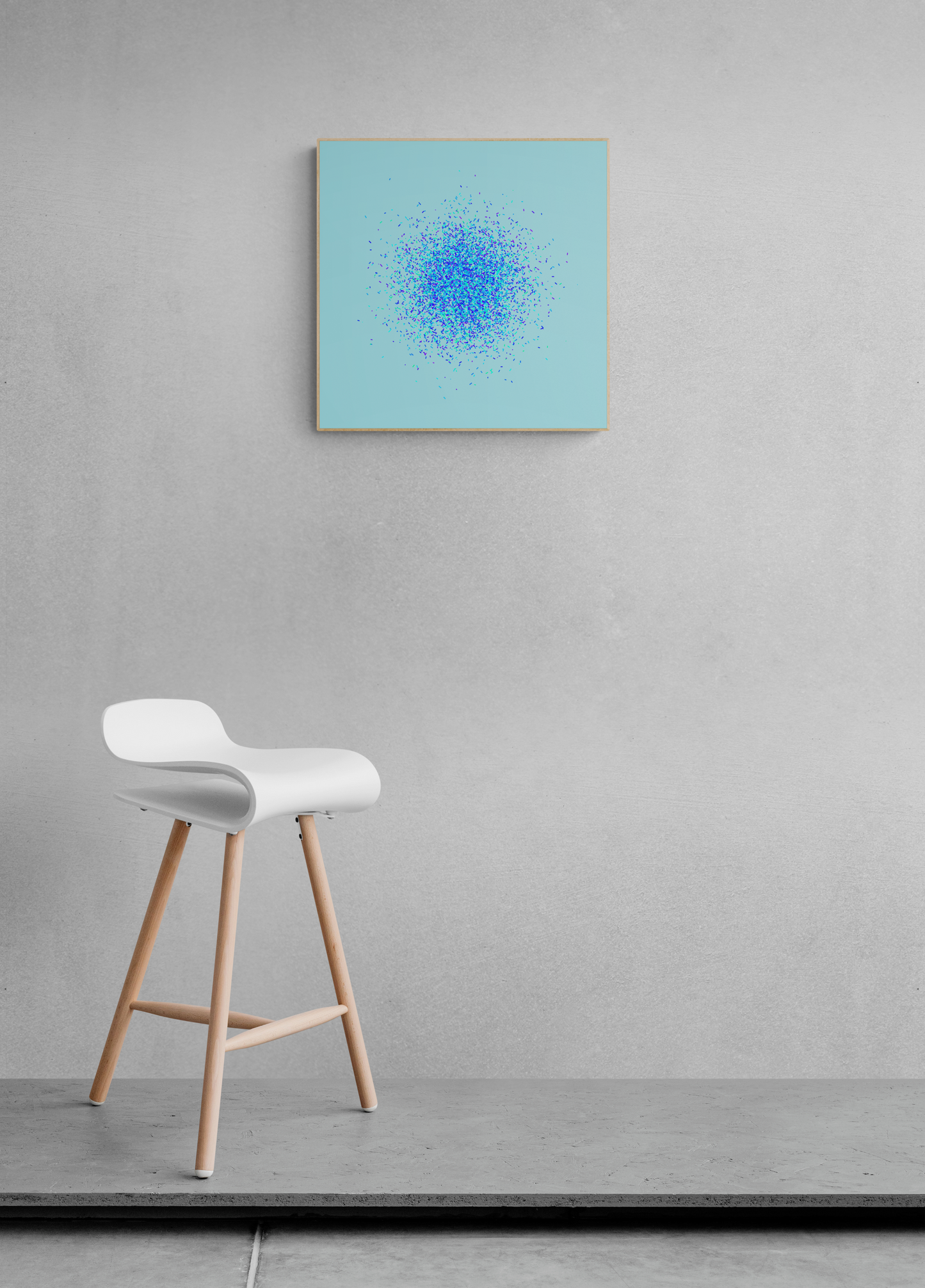 White stool with wooden legs in front of a gray wall with an abstract art print of blue, green and purple confetti like circular pattern on a light blue background.