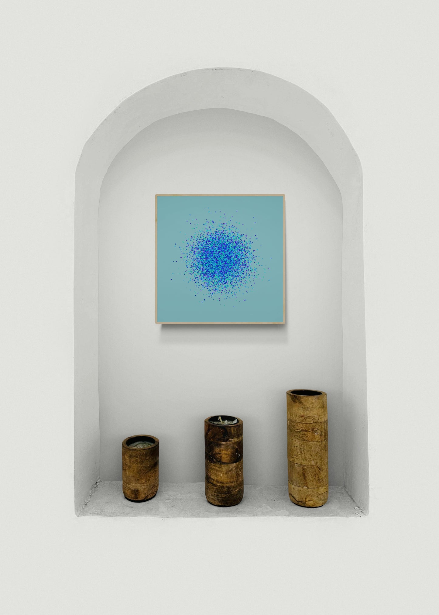 Artistic abstract art print of blue, green and purple confetti like circular pattern on a light blue background in a white archway with decorative vases.