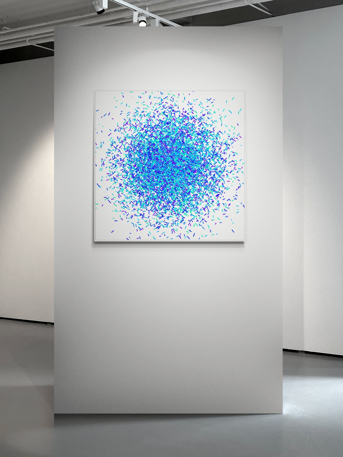 Colorful green blue confetti patterned abstract art print on a white background on a white wall in an art gallery.