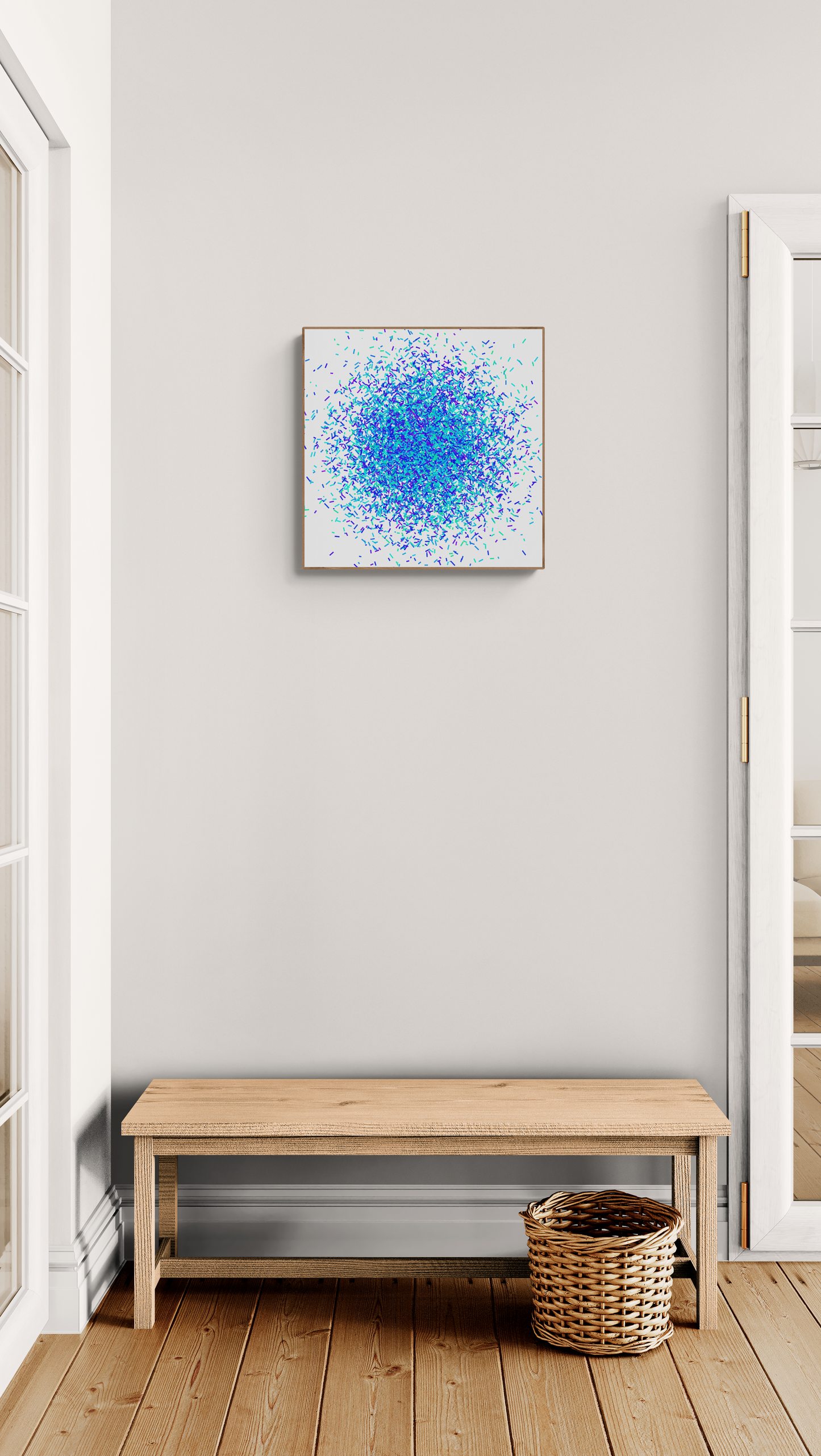 Modern interior with a wooden bench, woven basket, and colorful green blue confetti patterned abstract art print on a white background on a white wall.