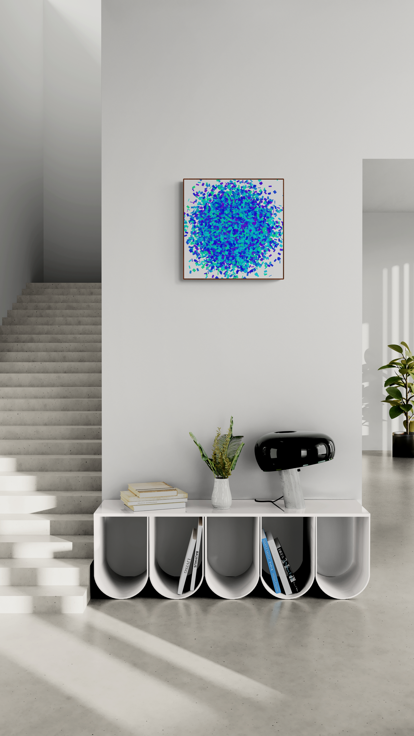 Modern interior with a white console table, books, and a colorful green blue confetti like patterned abstract art print on a white background against a light gray wall.