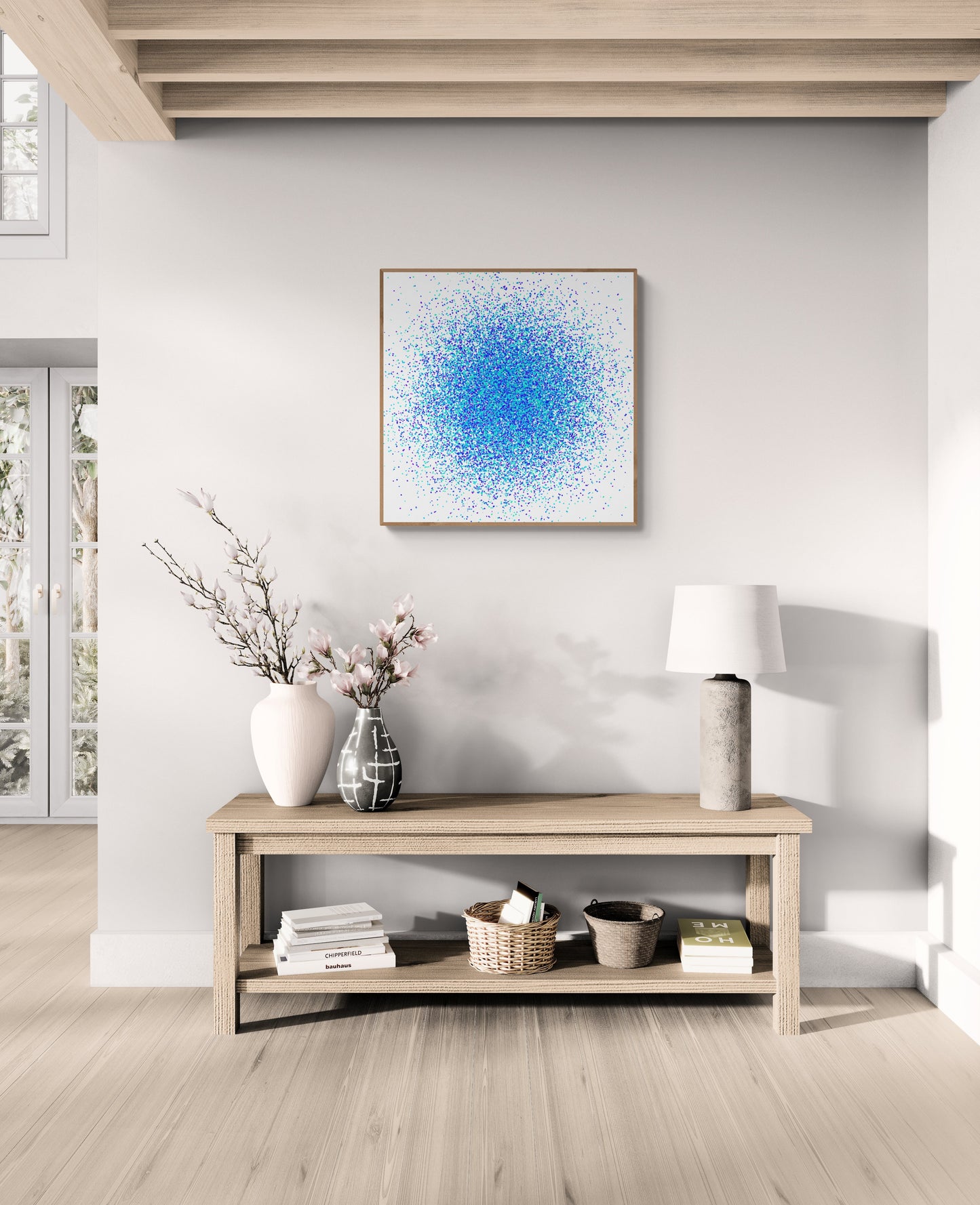 Living room with a wooden console table, decorative items, and colorful abstract blue and green dot like patterned art print on the wall.