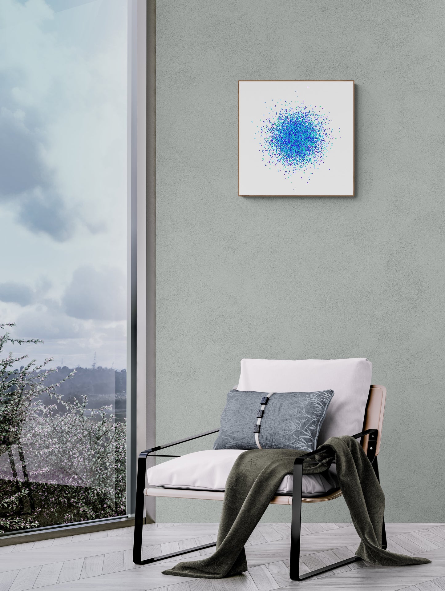 Modern chair with a gray blanket and pillows against a gray wall with a blue and green confetti like patterned abstract print on a white background