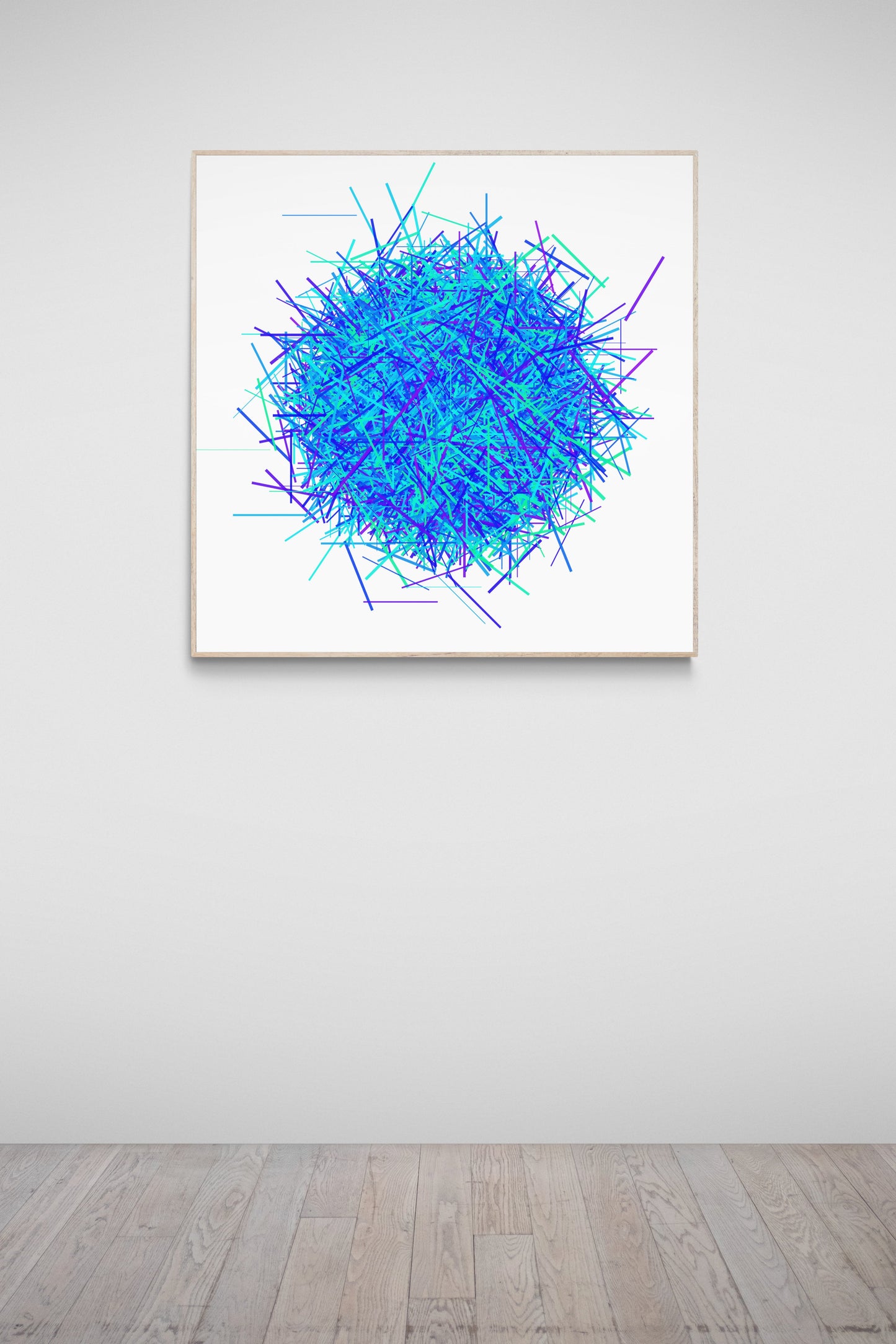 Abstract patterned print of intersecting blue, green and purple lines on a white background on a white wall