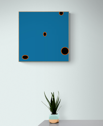 Abstract art print with blue background and black circles on a white wall, with a potted plant below.