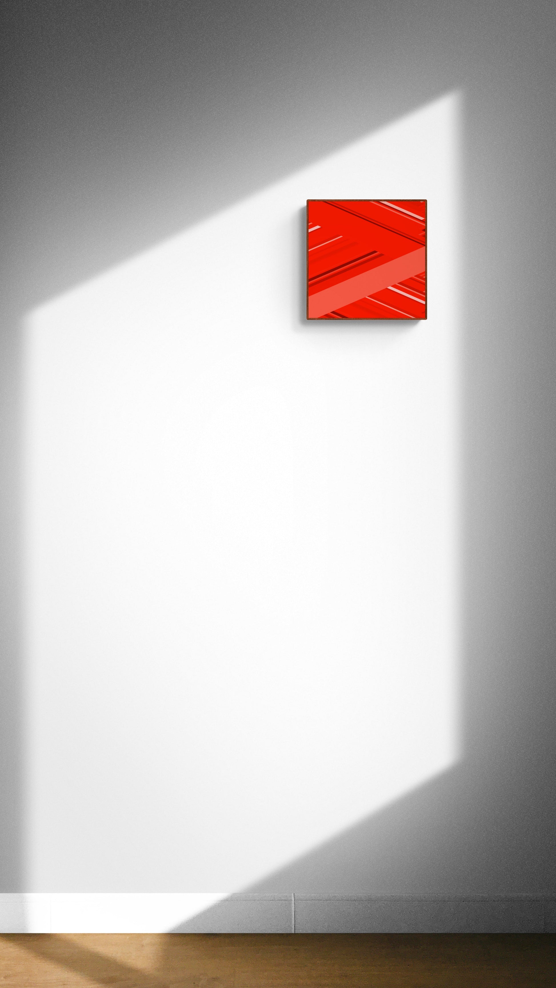 Abstract red square art print on a white wall with geometric shadow patterns