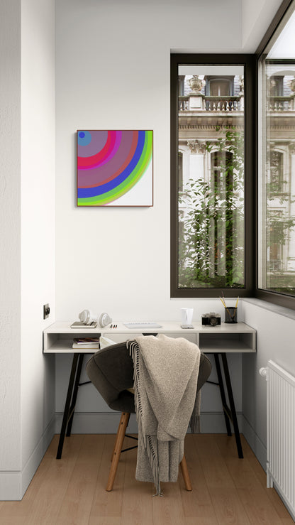 Modern home office with a desk, chair, and colorful abstract aart print on the wall.