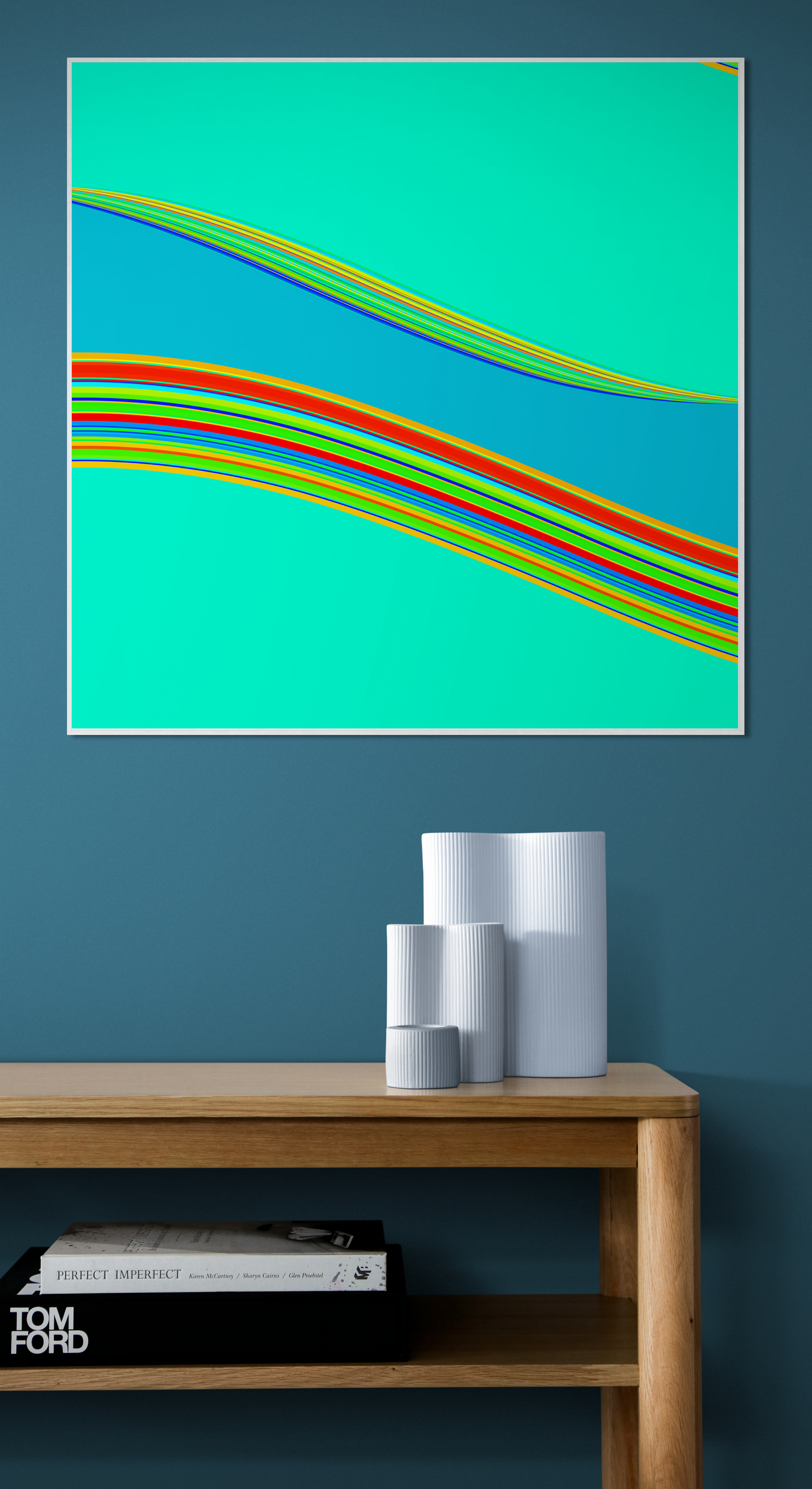 Abstract generative art print with colorful wavy lines on a teal background, displayed above a wooden shelf.