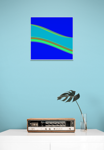 Abstract generative art print on a blue wall with a vintage radio and plant below.