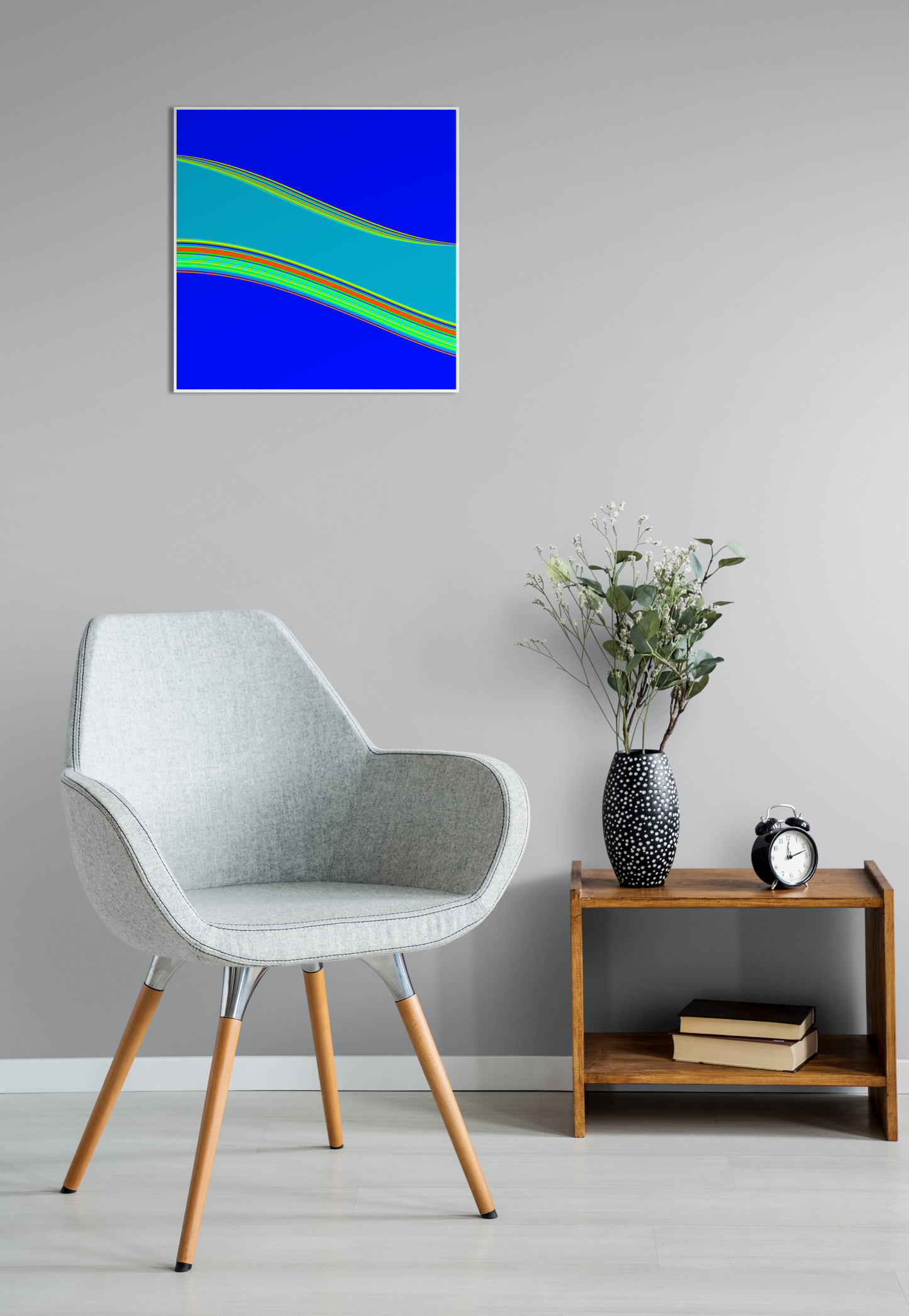 Modern interior with a chair, side table, and abstract generative art print on the wall.