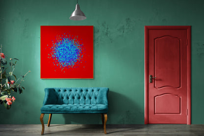 Room interior with a teal sofa, blue, green, purple confetti like patterned abstract print on a red background, and red door against a green wall.