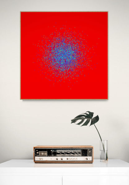 Blue, green, purple confetti like patterned abstract print on a red background, displayed above a table with a vintage radio and plant.