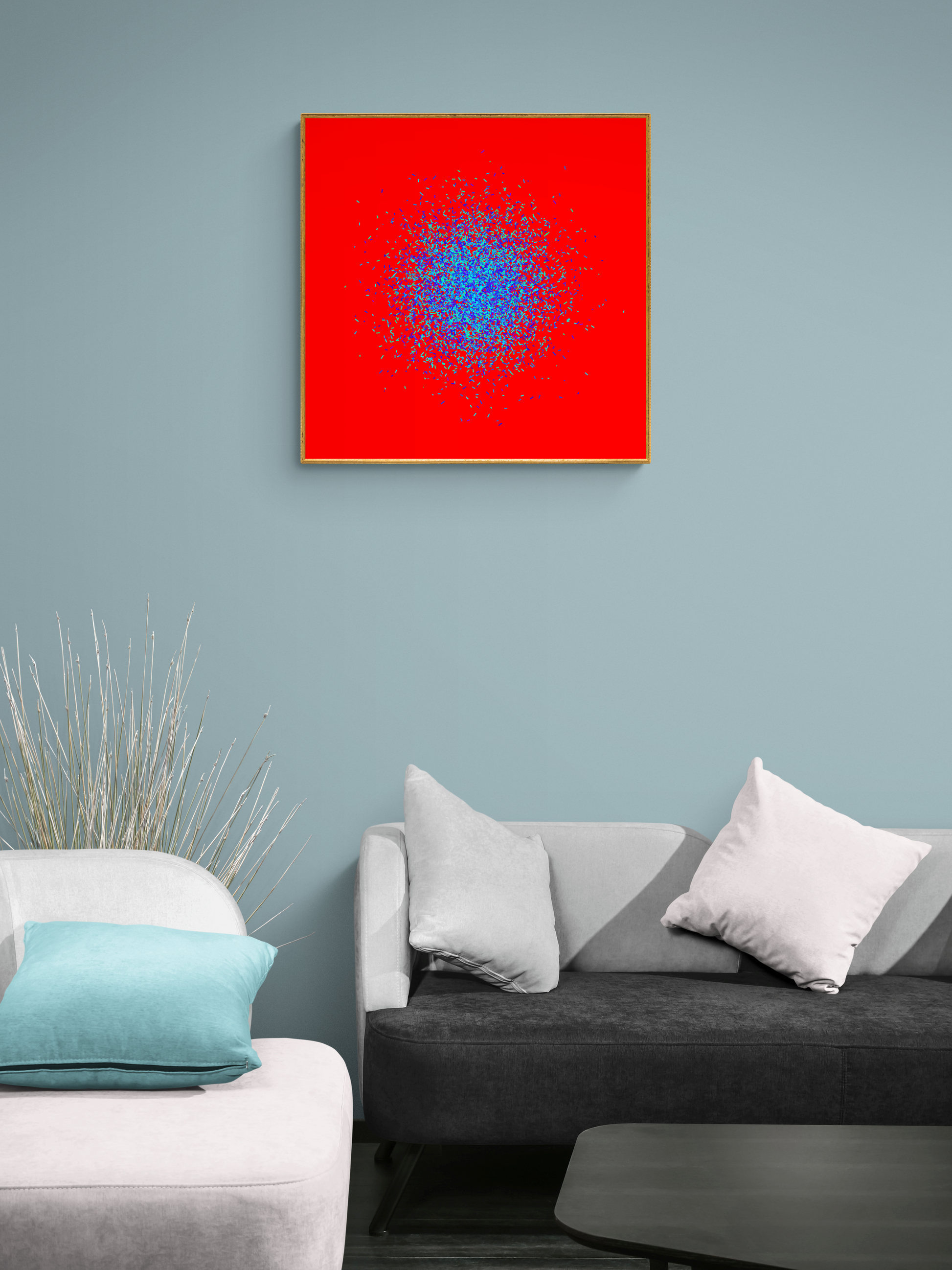 Blue, green, purple confetti like patterned abstract art print on a red background, displayed in a living room.