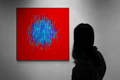 Person viewing an abstract patterned art print of blue and green lines on a red background