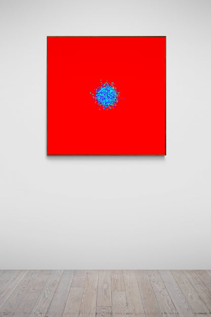 Abstract patterned art print of ball of blue and green fragments on a red background in an art gallery.