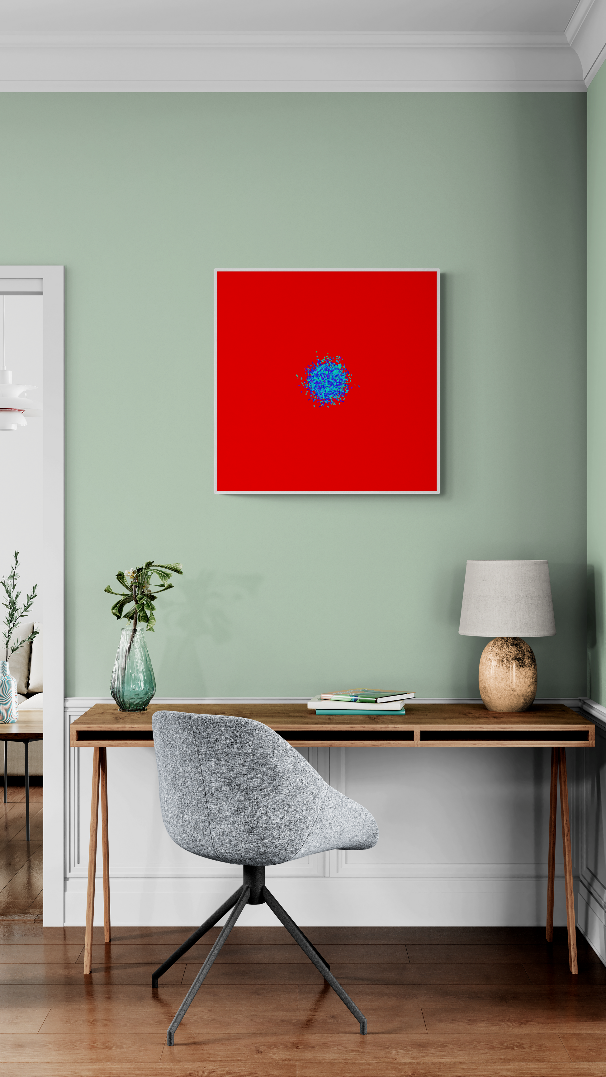 Abstract patterned art print of ball of blue and green fragments on a red background on a green wall, a desk, and chair.