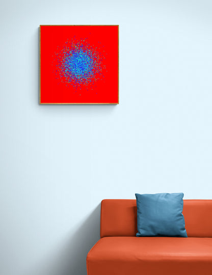 Blue, green, purple confetti like patterned abstract print on a red background on a light gray wall above an orange sofa with a blue pillow.