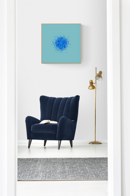 Navy blue armchair in a room with an abstract art print of blue, green and purple confetti like circular pattern on a light blue background on the wall.