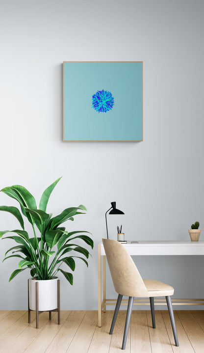 Modern interior with a plant, chair, and an abstract art print of blue, green and purple lines in a circular pattern on a light blue backgroundon a light gray wall.